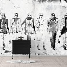 a black and white photo of people in different outfits on a wallpapered room