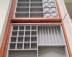 two wooden shelves with compartments on each side