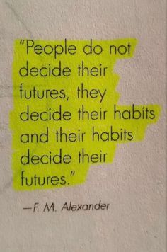 a piece of paper with the quote people do not decide their futures, they decide their habits and their habits decide their futures