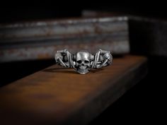 Motorcycle wheel with skull biker mens ring in sterling silver, Small dainitily gothic biker silver gift rings, Biker punk style men jewelry Biker rings are an indispensable attribute of modern tough-looking men, rebels, and those who seek thrill, freedom, speed, and roar of the engine. These items are a recognized symbol of courage, strength, and power. Carefully designed by Bysilverstone, this biker ring contains many symbols, these details are carefully handcrafted. Made of 925 sterling silve Punk Style Men, Motorcycle Wheels, Biker Rings, Style Punk, Men Jewelry, Mens Ring, Polish Silver, Punk Style, Silver Gifts