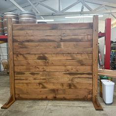 an unfinished wooden fence in a garage