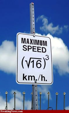 a speed limit sign on a pole with blue sky and clouds in the back ground