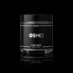 a jar of white flavy on a black background with the words osmo