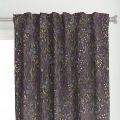 a purple curtain with flowers and plants on it