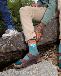 Elevate your footwear with socks that keep the spirit of high-altitude adventure alive. The knit-in design captures the awe-inspiring moment when dawn's first light paints the mountains in bold, vivid hues, bringing a touch of alpine wonder to your adventures, big and small. Features: Crafted from soft, sustainable organic cotton Unisex design available in S/M and L/XL sizes Perfect for outdoor adventures and everyday comfort Outdoor Socks, High Altitude, Cotton Socks, Light Painting, Awe Inspiring, Outdoor Adventures, One Light, Unisex Design, The Spirit