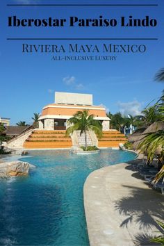 an outdoor swimming pool surrounded by palm trees and water features steps leading up to the building