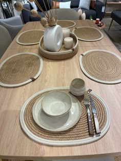 the table is set with place settings for four