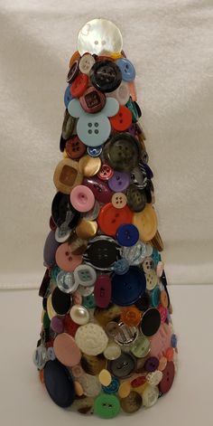 there is a small tower made out of buttons