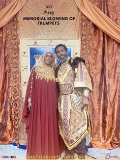 a man and woman dressed up in costume standing next to each other with the words memorial blowing of trumpets