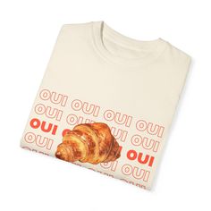 Oui Oui Croissant Tee! This is made to order, please allow up to 5 days to print and ship. We're dedicated to reducing waste and championing sustainability. Printed on unisex Comfort Colors tee. 100% cotton. Fit is true to size. Size up for an oversized fit! All pieces are made to order, so please allow 2-5 business days before shipping. Care Instructions: Please wash inside out in cold water to preserve color. Croissant Design, Butter Toast, Paris Shirt, French Pastry, Paris T Shirt, Reducing Waste, French Pastries, Oui Oui, Comfort Colors Tee