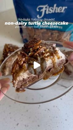 a person holding a piece of cake with nuts on it in front of a bag of fisher no - bake holiday desserts