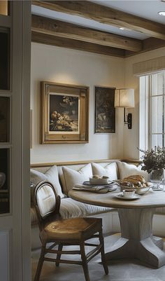 a living room filled with furniture next to a window