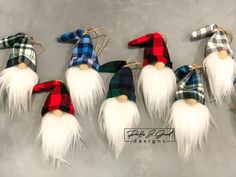 seven gnomes with long white hair and plaid scarves are lined up in a row