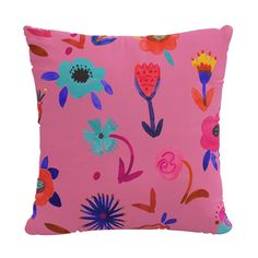 a pink pillow with colorful flowers on it