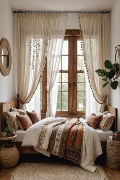 a bed sitting under a window in a bedroom