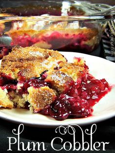 a piece of plum cobbler on a white plate