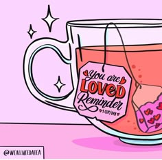 a tea cup filled with pink liquid and a tag that says you are loved reminder