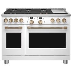 a white stove with two ovens and gold trim on the front, against a white background