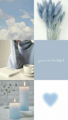 two blue candles sitting on top of a table next to a cup and saucer