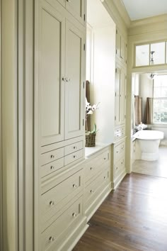 the instagram page for instagram com shows an image of a bathroom with white cabinets and wood floors