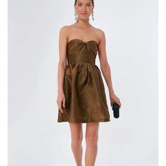 This Stunning Tuckernuck Dress In A Beautiful Bronze Color Is Perfect For Any Formal Occasion. The Dress Features A Geometric Jacquard Pattern With Accents Of Glitter, Ruffle, Layered Design, And A Zipper Closure. The Sleeveless Fit And Flare Mini Dress Is Made With High-Quality Jacquard Fabric And Is Perfect For Winter, Summer, Fall, And Spring. The Dress Is A Size Xs. The Dress Is Not Only Glamorous But Also Preppy, Making It A Perfect Fit For Weddings, Holy Communion, Parties, And Cocktail Ev Tuckernuck Dress, Anastasia Dress, Bronze Dress, Fit And Flare Mini Dress, Flare Mini Dress, Layered Design, Dress Xl, Jacquard Pattern, Mini Cocktail Dress