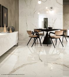 an elegant dining room with marble floors and walls