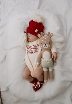 Santa's cutest little helper just got cuter with this soft bubble romper! This buttery soft, cream-colored, one-piece is made from 100% organic cotton for the ultimate comfort. With holly red embroidery that says "Santa's Little Helper," your baby will look absolutely festive this holiday season. Now bring on the gifts! Santa's Little Helper Romper matches our Luna + Luca Pom Beanie in Holly and the Luna + Luca Organic Booties in Holly 100% Organic Cotton Features: Snap closure at inseam Snap cl Girls Wedding Shoes, Communion Shoes, First Communion Shoes, Maternity Pajamas, Flower Girl Shoes, French Baby, Diaper Bag Accessories, Baby Basics, Newborn Christmas