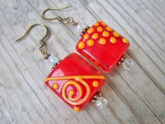 Lampwork Copper Glass Swirl Polka Dot Beaded by gristmilldesigns, $16.95 Orange Products, Funky Patterns, Business Team, Creative Friends, Copper Glass, Jewelry Making Ideas, Fun Earrings, Earrings Etsy, Handmade Design