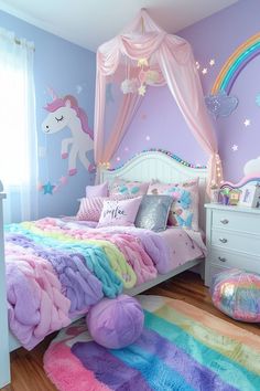 a bedroom decorated in pastel colors with unicorns and rainbow rugs on the floor