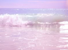 the water is pink and white with some waves