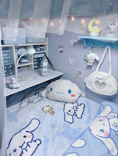 a blue and white baby's room with stuffed animals