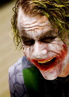 a close up of a person dressed as the joker