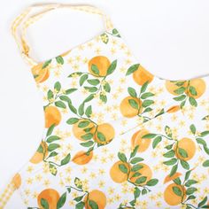 an apron that has oranges on it