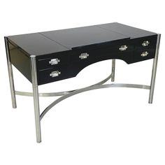 a black and chrome desk with drawers