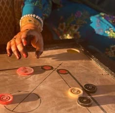 a close up of a person's hand on a board game