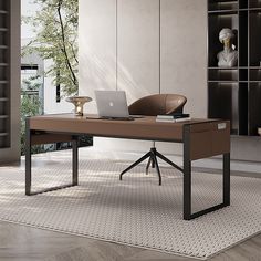 an office desk with a laptop on it in front of a bookcase and bookshelf