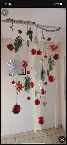 christmas decorations hanging from the ceiling in a room