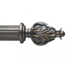 an ornate metal handle with leaves on it's end and a finial in the middle