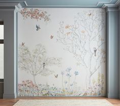 an empty room with a wall painted with flowers and birds