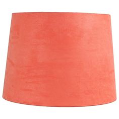 an orange lamp shade on a white background