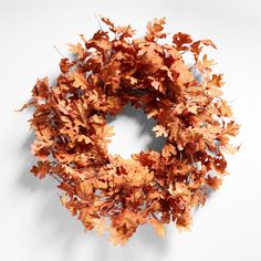 a wreath made out of leaves on a white background