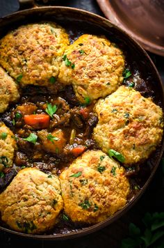 a pot filled with meat and vegetables covered in gravy