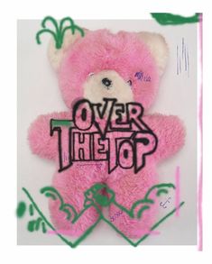 a pink teddy bear with the words over the top on it's back side