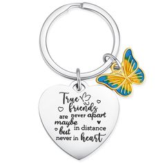 a heart shaped keychain with a butterfly on it and the words true friends are never