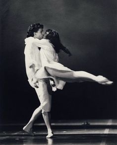 a man and woman dance together on stage