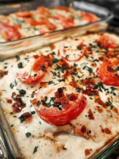 two glass casserole dishes with tomatoes and cheese