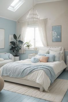 a bedroom with blue walls and white furniture