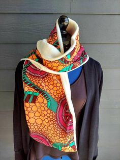 These are African prints neck warmers/ scarves are designed and backed with fleece to give it a warmer feel and to protect you from the cold during the winter.   They are so colorful they make you stand out and completes your look..It is beautiful,unique, mordern, ethnic soft and comfortable on the skin.. The African fabric is high quality wax print  100% Cotton. They can be a unique gift for the Christmas.. They can be given as birthday gifts..They can also be worn as accessories..The length is Ankara Scarf Styles, Winter Scarf As A Gift, Casual One Size Scarves As A Gift, One Size Winter Scarves For Gifts, Handmade Winter Scarves As Gift, Winter Gift Scarf One Size, Brown Winter Scarves For Gift, Casual One-size Scarf As Gift, Brown Winter Scarves For Gifts