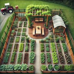 an aerial view of a vegetable garden in the middle of a yard with a tractor parked next to it