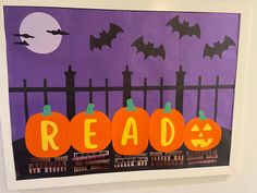 an art project with pumpkins and bats in front of a purple background that reads read